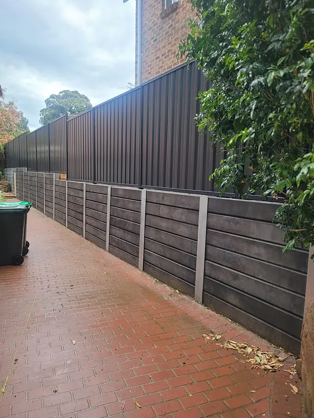 Sleeper wall along a new fence line