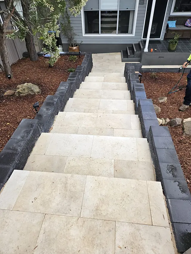 Paved steps and landing down the side